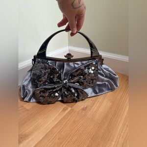 Elegant Silver Sequin Bow Handbag with chain crossbody